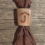 a scarf knot with a copper inlay