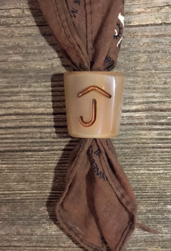 a scarf knot with a copper inlay