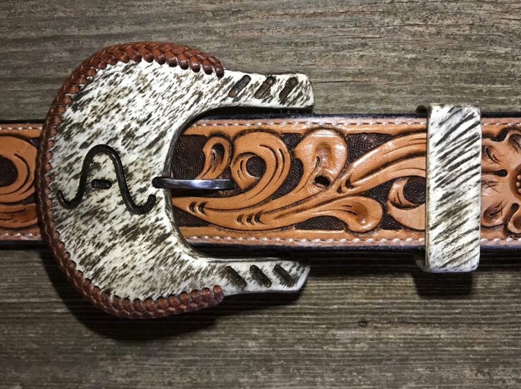 light_color_11/2_inch_buckle_roughout_finish_copper_inlay_slashes_whiskey_braid